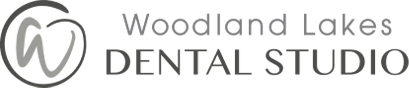 woodland lakes dental studio logo